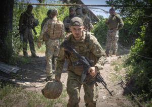 EFREM LUKATSKY / AP
                                Ukrainian soldiers attend their positions, in the Donetsk region, Ukraine, Saturday.