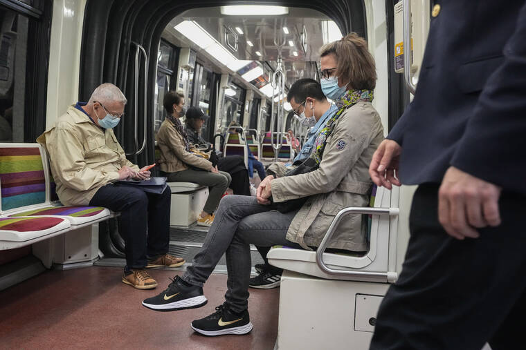 ASSOCIATED PRESS / JUNE 30
                                People wearing face masks to protect against COVID-19 ride a subway in Paris, Thursday. Virus cases are rising fast in France and other European countries after COVID-19 restrictions were lifted in the spring.