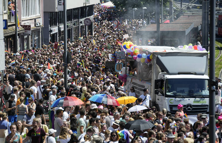 ASSOCIATED PRESS
                                Participants of the Cologne Pride rally march through the city center in Cologne, Germany. This year’s Christopher Street Day (CSD) Gay Parade with thousands of demonstrators for LGBTQ rights is the first after the coronavirus pandemic to be followed by hundreds of thousands of spectators in the streets of Cologne.