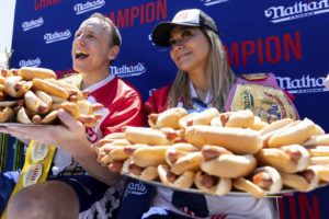 ASSOCIATED PRESS
                                Joey Chestnut and Miki Sudo pose with 63 and 40 hot dogs, respectively, after winning the Nathan’s Famous Fourth of July hot dog eating contest in Coney Island, today, in New York.