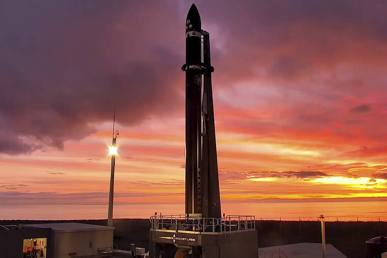ROCKET LAB VIA ASSOCIATED PRESS
                                Rocket Lab’s Electron rocket waits on the launch pad on the Mahia peninsula in New Zealand, June 28. A satellite the size of a microwave oven successfully broke free from its orbit around Earth on Monday and is headed toward the moon, the latest step in NASA’s plan to land astronauts on the lunar surface again.
