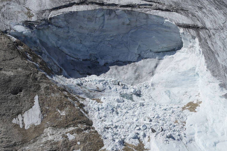 ASSOCIATED PRESS
                                A view taken from a rescue helicopter of the Punta Rocca glacier near Canazei, in the Italian Alps in northern Italy, today, two days after a huge chunk of the glacier broke loose, sending an avalanche of ice, snow, and rocks onto hikers.
