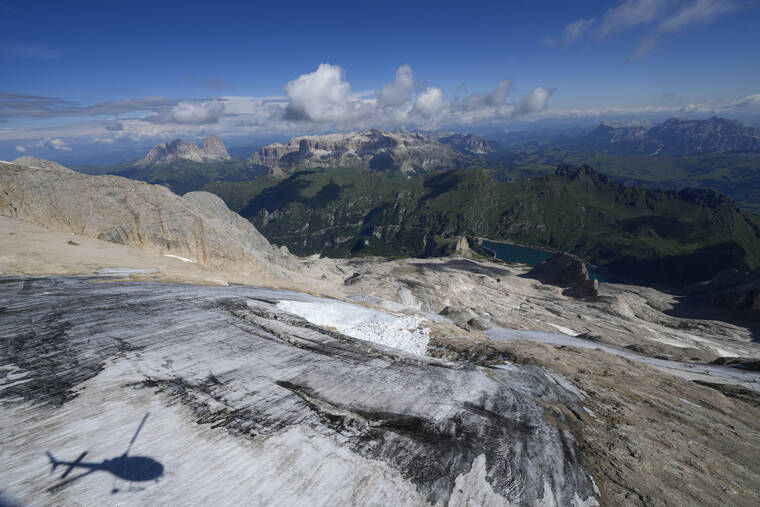 ASSOCIATED PRESS
                                A view taken from a rescue helicopter of the Punta Rocca glacier near Canazei, in the Italian Alps in northern Italy, today, two days after a huge chunk of the glacier broke loose, sending an avalanche of ice, snow, and rocks onto hikers.