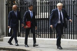 TOBY MELVILLE/PA VIA ASSOCIATED PRESS
                                From left, British Health Secretary Sajid Javid, Chancellor of the Exchequer Rishi Sunak and Prime Minister Boris Johnson arrive at No 9 Downing Street for a media briefing in May 2021. Two of Britain’s most senior Cabinet ministers have quit, a move that could spell the end of Prime Minister Boris Johnson’s leadership after months of scandals.