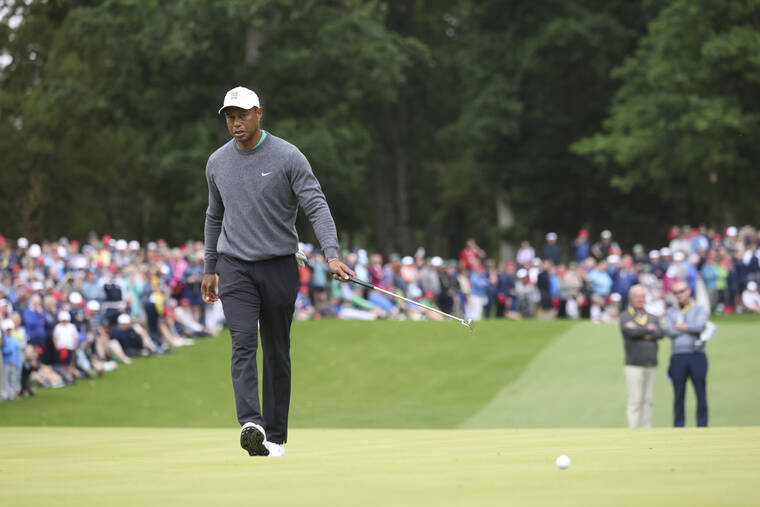 ASSOCIATED PRESS
                                U.S golfer Tiger Woods putts on the third green during the JP McManus Pro-Am at Adare Manor, Ireland, today.