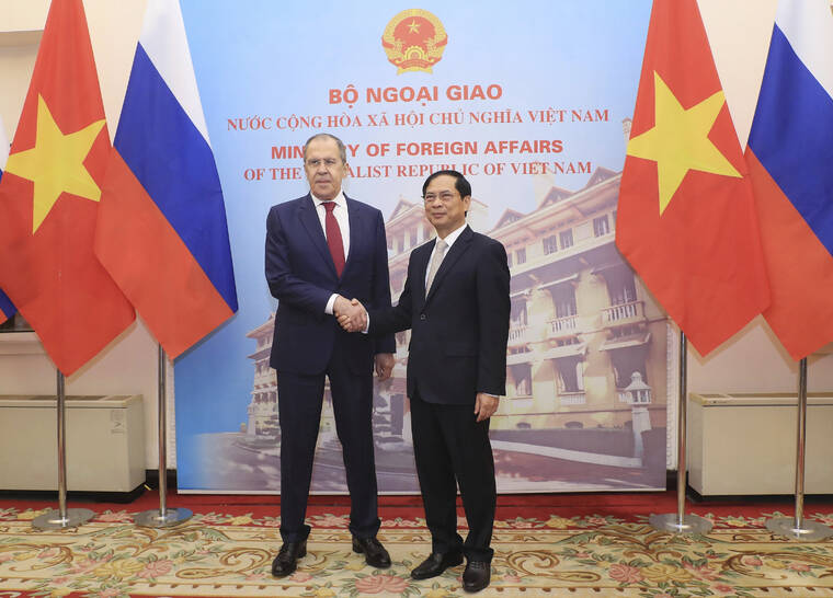 VNA VIA AP
                                Russian Foreign Minister Sergey Lavrov, left, and Vietnamese Foreign Minister Bui Thanh Son shake hands in Hanoi, Vietnam on Wednesday.