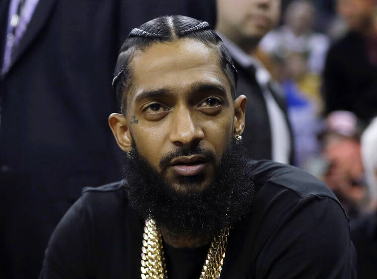 ASSOCIATED PRESS
                                Rapper Nipsey Hussle attends an NBA game between the Golden State Warriors and the Milwaukee Bucks in Oakland, Calif., in March 2018. Jurors found a 32-year-old man guilty of first-degree murder today for the 2019 fatal shooting of rapper Nipsey Hussle.