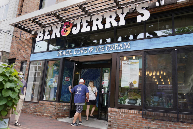 ASSOCIATED PRESS
                                Two patrons enter the Ben & Jerry’s Ice Cream shop, in July 2021, in Burlington, Vt. The Vermont-based ice cream maker is suing its corporate parent Unilever over a plan that would allow its product to be sold in east Jerusalem and the occupied West Bank.