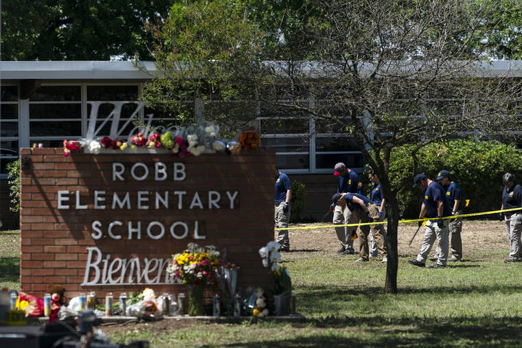 ASSOCIATED PRESS
                                Investigators search for evidence outside Robb Elementary School in Uvalde, Texas, May 25, after an 18-year-old gunman killed 19 students and two teachers. The district’s superintendent said, today, that Chief Pete Arredondo, the Uvalde school district’s police chief, has been put on leave following allegations that he erred in his response to the mass shooting.