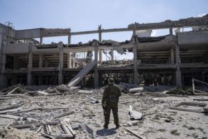 ASSOCIATED PRESS
                                Ukrainian serviceman looks at the National Pedagogic university destroyed by a Russian attack in Kharkiv, Ukraine, today.