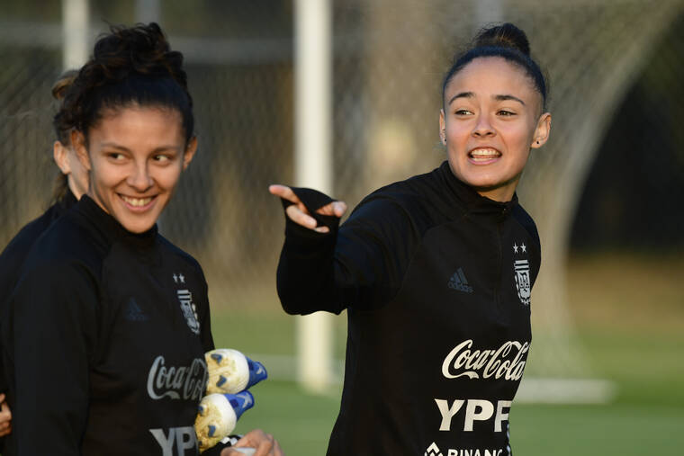 ASSOCIATED PRESS
                                Argentina women´s national soccer team players Marina Delgado, right, points at Julieta Cruz during a training session at the Argentina Football Association in Buenos Aires, Argentina, on June 16.