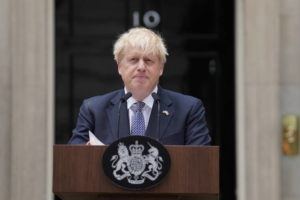 PA VIA AP
                                Prime Minister Boris Johnson reads a statement outside 10 Downing Street, London, formally resigning as Conservative Party leader, in London today. Johnson said he will remain as British prime minister while a leadership contest is held to choose his successor.