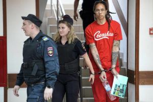 ASSOCIATED PRESS
                                WNBA star and two-time Olympic gold medalist Brittney Griner is escorted to a courtroom for a hearing in Khimki, just outside Moscow, today.