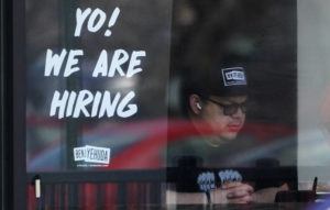 ASSOCIATED PRESS
                                A hiring sign is displayed at a restaurant in Schaumburg, Ill., April 1. More Americans applied for unemployment benefits last week, and while layoffs remain low, it’s the fifth straight week claims have topped the 230,000 mark.