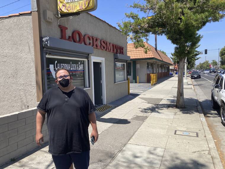 ASSOCIATED PRESS
                                Nick Barragan wears a mask while running errands in Los Angeles on Wednesday. Los Angeles County is facing a return to a broad indoor mask requirement if current trends in hospital admissions continue, health officials said. Barragan said he’s disappointed that the fast spread of COVID-19 could mean the return of a mandate, but he’s used to wearing a mask because it’s always been required for his job in film production.