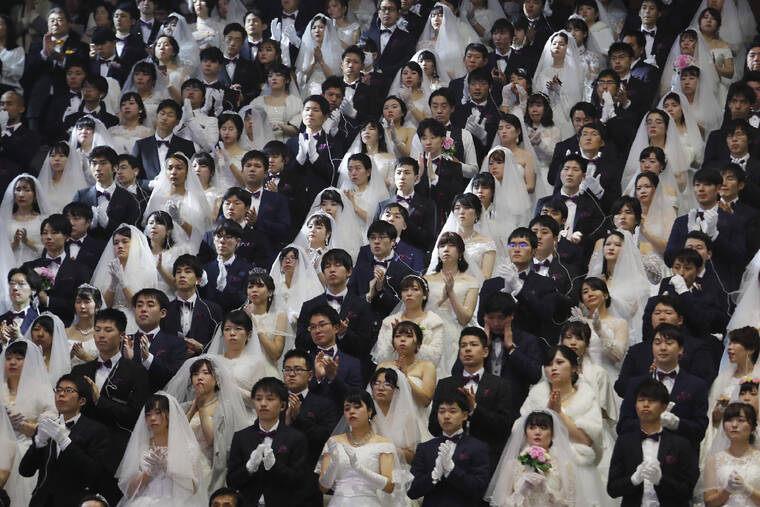 ASSOCIATED PRESS / 2020
                                Couples from around the world attend a mass wedding ceremony at the Cheong Shim Peace World Center in Gapyeong, South Korea. South Korean and foreign couples exchanged or reaffirmed marriage vows in the Unification Church’s mass wedding arranged by Hak Ja Han Moon, wife of the late Rev. Sun Myung Moon, the controversial founder of the Unification Church.