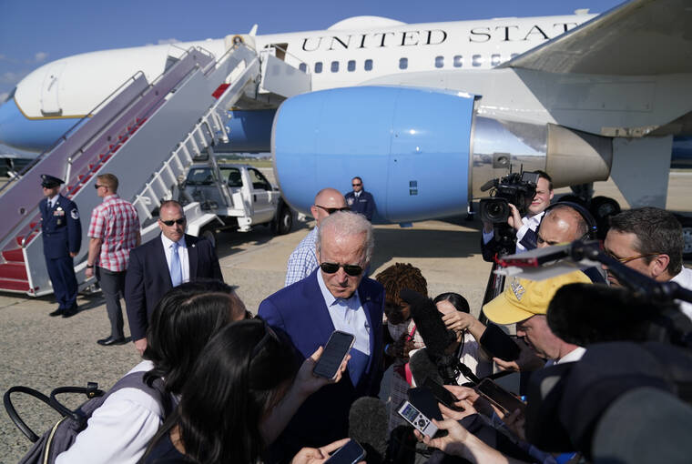 ASSOCIATED PRESS
                                President Joe Biden speaks to members of the media after exiting Air Force One, Wednesday, at Andrews Air Force Base, Md. Biden is returning from a trip to Somerset, Mass., where he spoke about climate change.