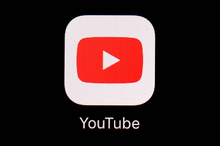 ASSOCIATED PRESS The YouTube app is displayed on an iPad in Baltimore in March 2018. YouTube announced, today, it will begin removing misleading videos about abortion in response to falsehoods being spread about the procedure that is being banned or restricted across a broad swath of the U.S.