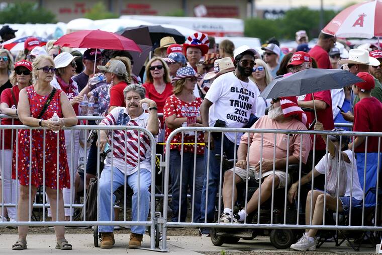ASSOCIATED PRESS
                                Supporters of Donald Trump wait in line hours before the former president is set to speak at a rally Friday in Prescott, Ariz.