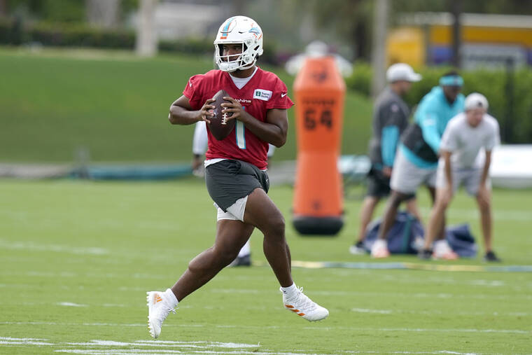 ASSOCIATED PRESS
                                Miami Dolphins quarterback Tua Tagovailoa takes part in drills on Wednesday.