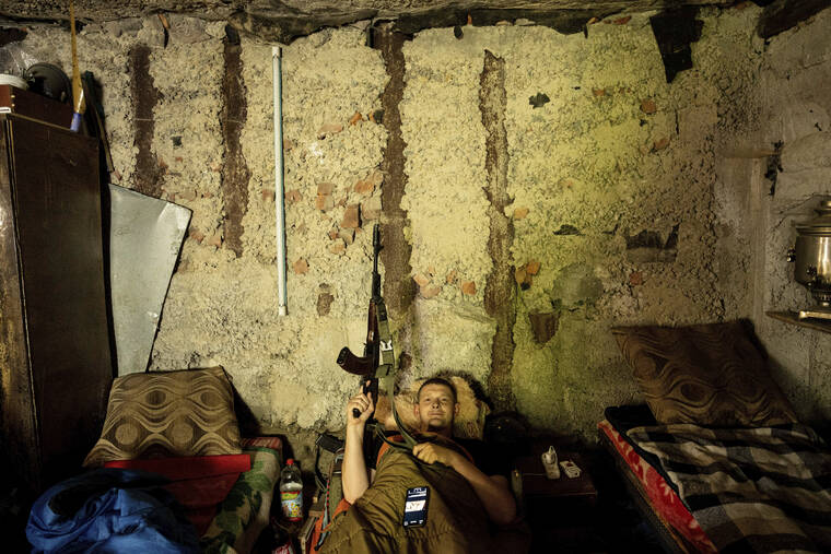 ASSOCIATED PRESS
                                A Ukrainian serviceman rests in a basement between fightings with Russian forces at a frontline in the Kharkiv region, Ukraine, Wednesday.