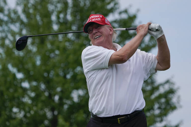 ASSOCIATED PRESS
                                Former President Donald Trump plays during the pro-am round of the Bedminster Invitational LIV Golf tournament in Bedminster, NJ., today.
