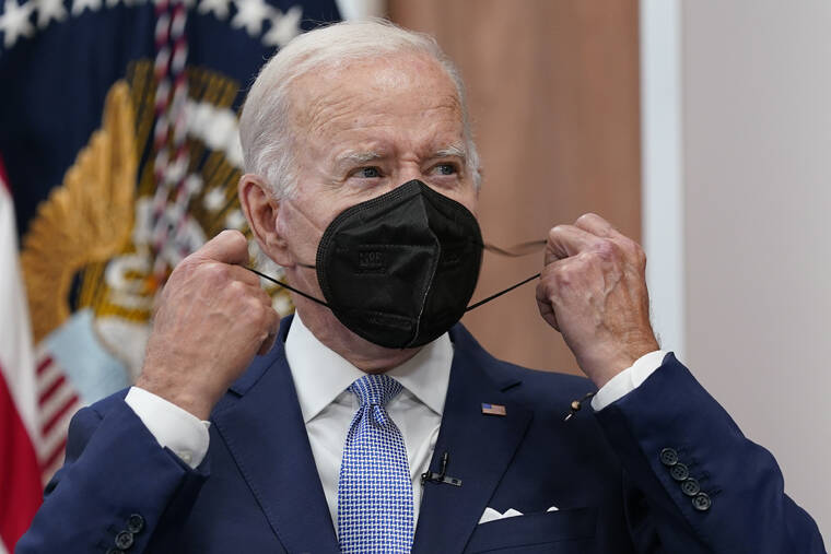 ASSOCIATED PRESS
                                President Joe Biden removes his face mask as he arrives to speak about the economy during a meeting with CEOs in the South Court Auditorium on the White House complex Thursday. Biden tested positive for COVID-19 again Saturday, July 30, slightly more than three days after he was cleared to exit coronavirus isolation, the White House said.