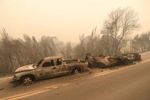 SCOTT STODDARD / GRANTS PASS DAILY COURIER via AP
                                A pickup truck and a trailer burned overnight in the middle of state Highway 96 by the McKinney Fire in Klamath River, Calif., today.
