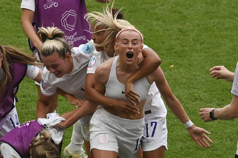 ASSOCIATED PRESS
                                England’s Chloe Kelly, centre, celebrates with teammates after scoring her side’s second goal during the Women’s Euro 2022 final soccer match between England and Germany at Wembley stadium in London.
