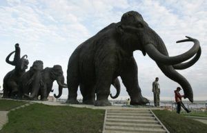 ASSOCIATED PRESS / 2008
                                A sculpture of mammoths is seen in the Siberian town of Khanty-Mansiisk, 2000 kilometers (1250 miles) east of Moscow, Russia.