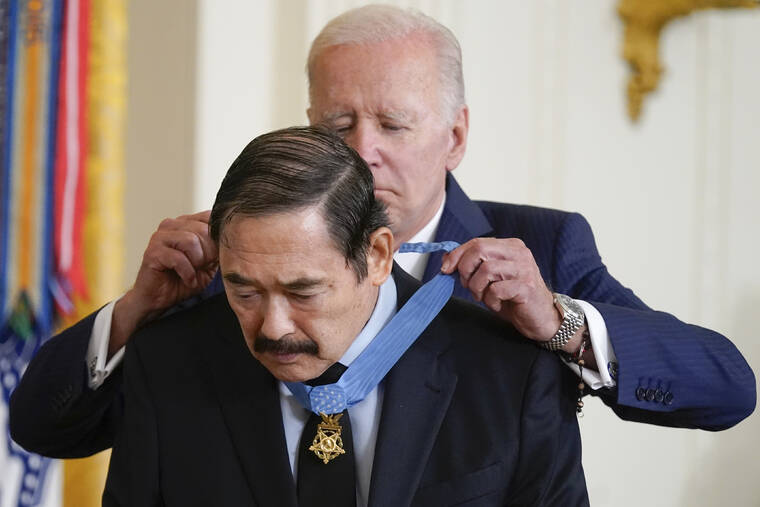 EVAN VUCCI / AP
                                President Joe Biden awards the Medal of Honor to Spc. Dennis Fujii for his actions on Feb. 18-22 1971, during the Vietnam War, during a ceremony in the East Room of the White House, Tuesday, July 5, in Washington.