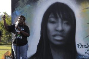 ASSOCIATED PRESS / 2020
                                Tonya Isabell, left, speaks during a vigil for her cousin Charleena Lyles, pictured at right, on the third anniversary of her death, in Seattle.