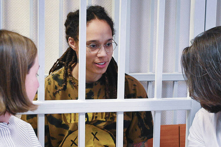 ASSOCIATED PRESS
                                WNBA star Brittney Griner spoke with her lawyers Friday before a hearing in her trial at Khimki district court outside Moscow.