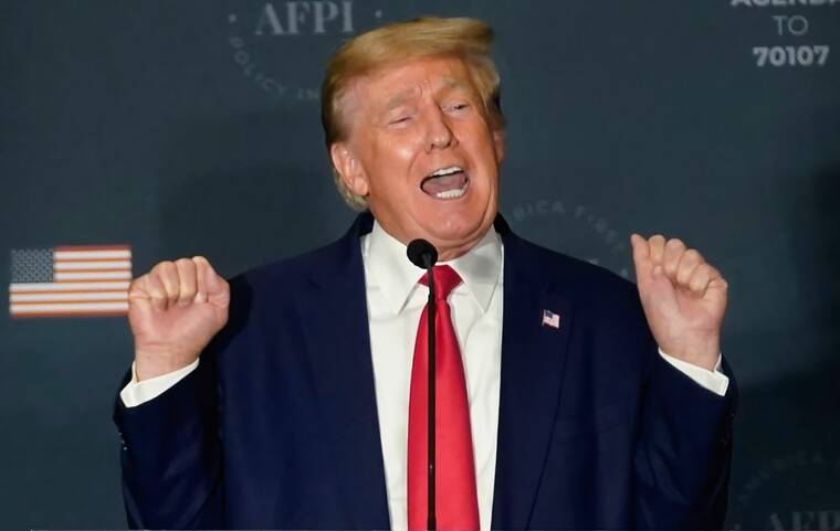 ASSOCIATED PRESS
                                Former President Donald Trump talks about lifting weights as he speaks at an America First Policy Institute agenda summit at the Marriott Marquis in Washington, today.