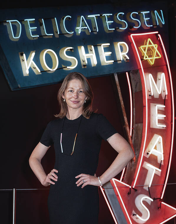 NEW YORK TIMES
                                Jessie Kornberg, chief executive of the Skirball Cultural Center in Los Angeles, poses with a neon sign for the institution’s traveling exhibition on the Jewish delicatessen.