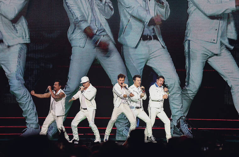 INVISION / AP
                                NKOTB members Danny Wood, from left, Donnie Wahlberg, Joey McIntyre, Jordan Knight and Jonathan Knight perform during their 2019 Mixtape Tour.