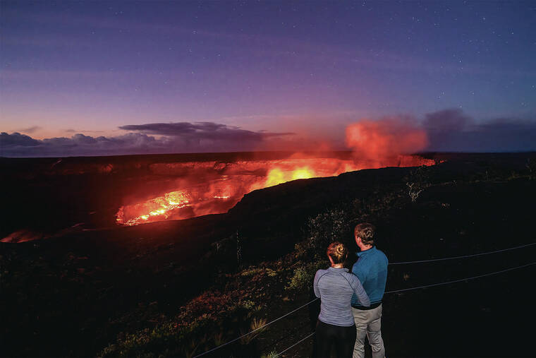 NATIONAL PARK SERVICE 
                                A couple watches the rising lava lake within the summit of Kilauea Volcano before sunrise at the Uekahuna overlook in Hawai‘i Volcanoes National Park.