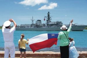 U.S. NAVY / JUNE 28
                                A family waves to the Chilean navy frigate CNS Almirante Lynch as it arrives at Joint Base Pearl Harbor-­Hickam to participate in Rim of the Pacific 2022.