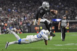 ASSOCIATED PRESS
                                Las Vegas Raiders’ Marcus Mariota (8) runs for a gain against Los Angeles Chargers safety Alohi Gilman (32) during the second half of an NFL football game, in Las Vegas.