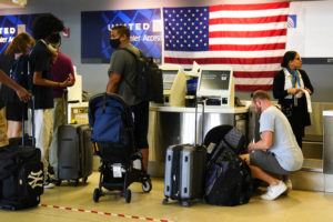ASSOCIATED PRESS
                                Travelers check in at the Philadelphia International Airport ahead of the Independence Day holiday weekend in Philadelphia. The July Fourth holiday weekend is off to a booming start with airport crowds crushing the numbers seen in 2019, before the pandemic.
