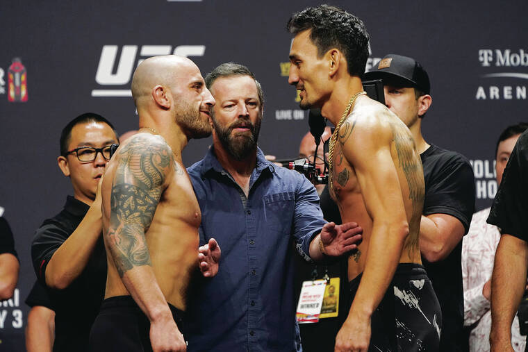 Associated Press
                                Alexander Volkanovski, left, and Max Holloway faced off during a ceremonial weigh-in on Friday.