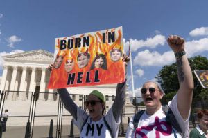 ASSOCIATED PRESS
                                Abortion rights supporters protest outside the Supreme Court in Washington on June 25.