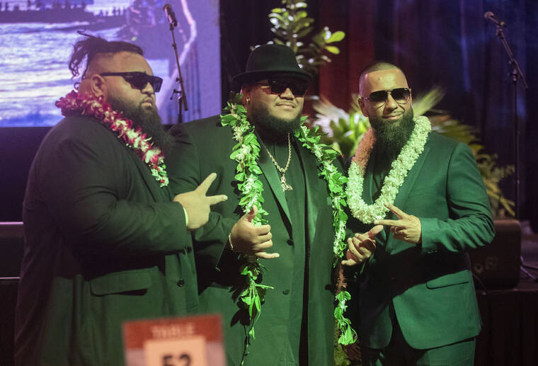 CINDY ELLEN RUSSELL / CRUSSELL@STARADVERTISER.COM
                                Josh Tatofi, center, posed Wednesday with musicians Tue Vaea, at left, and Travis Kaka before the 45th Annual Na Hoku Hanohano Awards. Tatofi received four awards for his work as a recording artist and music video producer.