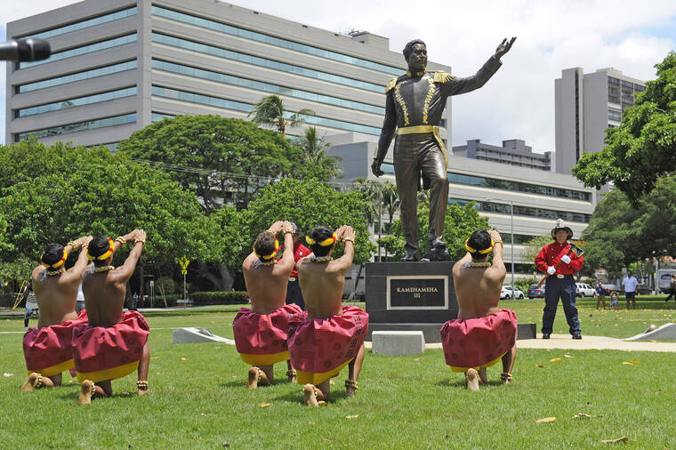 STAR-ADVERTISER / 2018
                                The men of the Kawai‘ulaokala halau dance during the dedication of the Kamehameha III sculpture at Thomas Square on July 31, 2018, in honor of King Kamehameha III and La Ho‘iho‘i Ea.