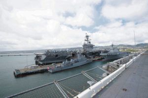 CINDY ELLEN RUSSELL / CRUSSELL@STARADVERTISER.COM
                                RIMPAC, the biennial multinational exercise, began June 29 and runs through Aug. 4 with more than 25,000 personnel participating. The aircraft carrier USS Abraham Lincoln was laden with jets.