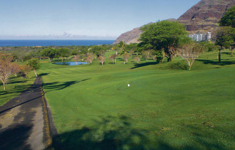 STAR-ADVERTISER / 2002
                                A U.S. bankruptcy judge approved the $20.7 million sale of 644 acres in Makaha Valley to Seoul-based KH Group. Prior plans to develop a major resort in the valley never materialized beyond a hotel, two golf courses and a few homes. Seen is the Makaha Valley Country Club’s 17th hole.