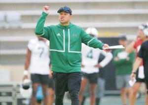 JAMM AQUINO / MARCH 2022 
                                First-year University of Hawaii football coach Timmy Chang has worked to build a family atmosphere within the Rainbow Warriors program.
