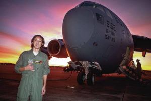 COURTESY BJ ITOMAN
                                Former Rainbow Wahine basketball star BJ Itoman posed in front of a C-17 transport aircraft last year.