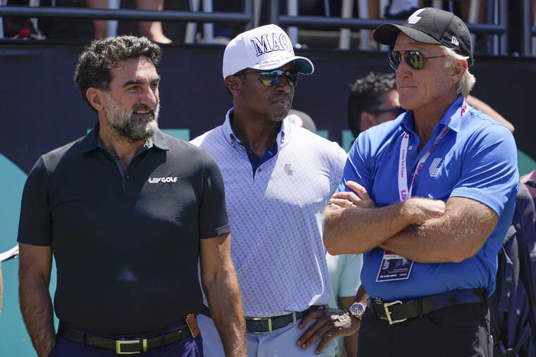ASSOCIATED PRESS
                                Yasir Al-Rumayyan, governor of Saudi Arabia’s Public Investment Fund, left, Majed Al-Sorour, CEO of Golf Saudi, center, and Greg Norman, CEO of LIV Golf, watch at the first tee during the second round of the Bedminster Invitational LIV Golf tournament in Bedminster, N.J., Saturday.