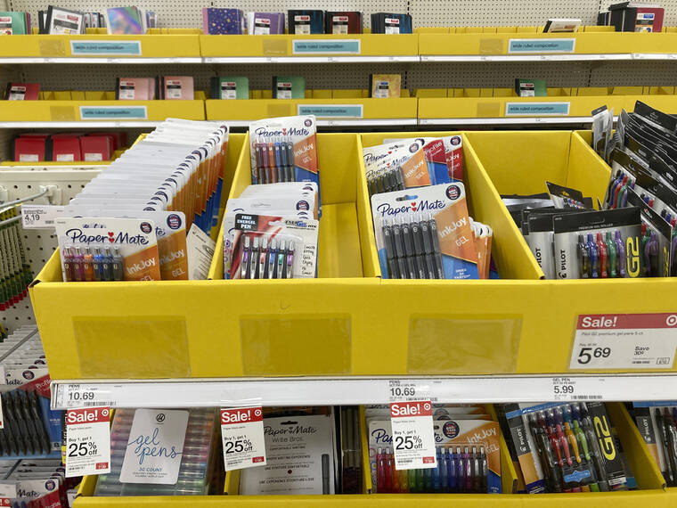 ASSOCIATED PRESS
                                Back-to-school and office supplies are on sale at a Target store, July 27, in North Miami, Fla. Back-to-school shopping is extra expensive this year, due to inflation. But coordinating with people in your community can help you save money.